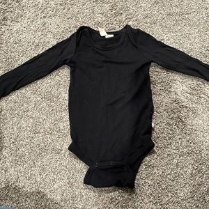 Kyte Baby black long sleeve bodysuit 12-18 months, good condition.